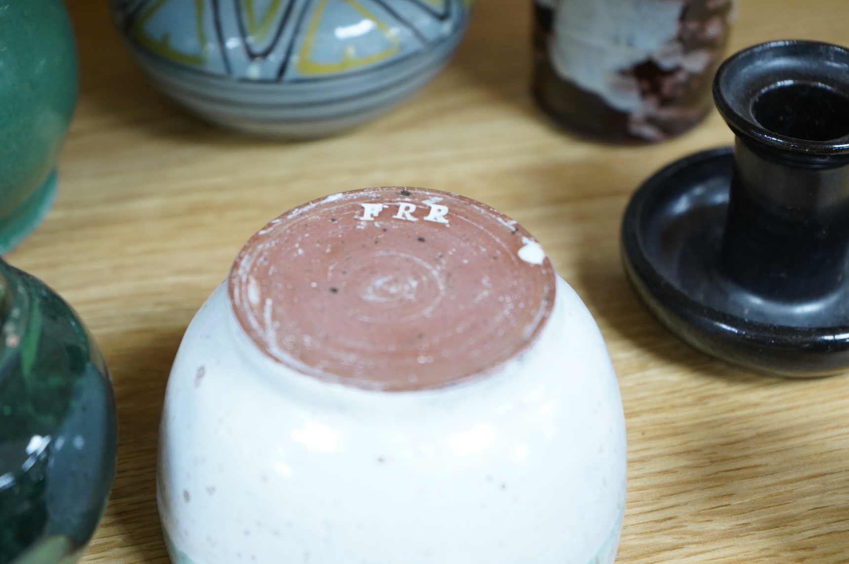 A collection of studio pottery to include a small Danish squat vase, a Brannam, Devon vase and three small Dickerware pieces, largest 13cm high